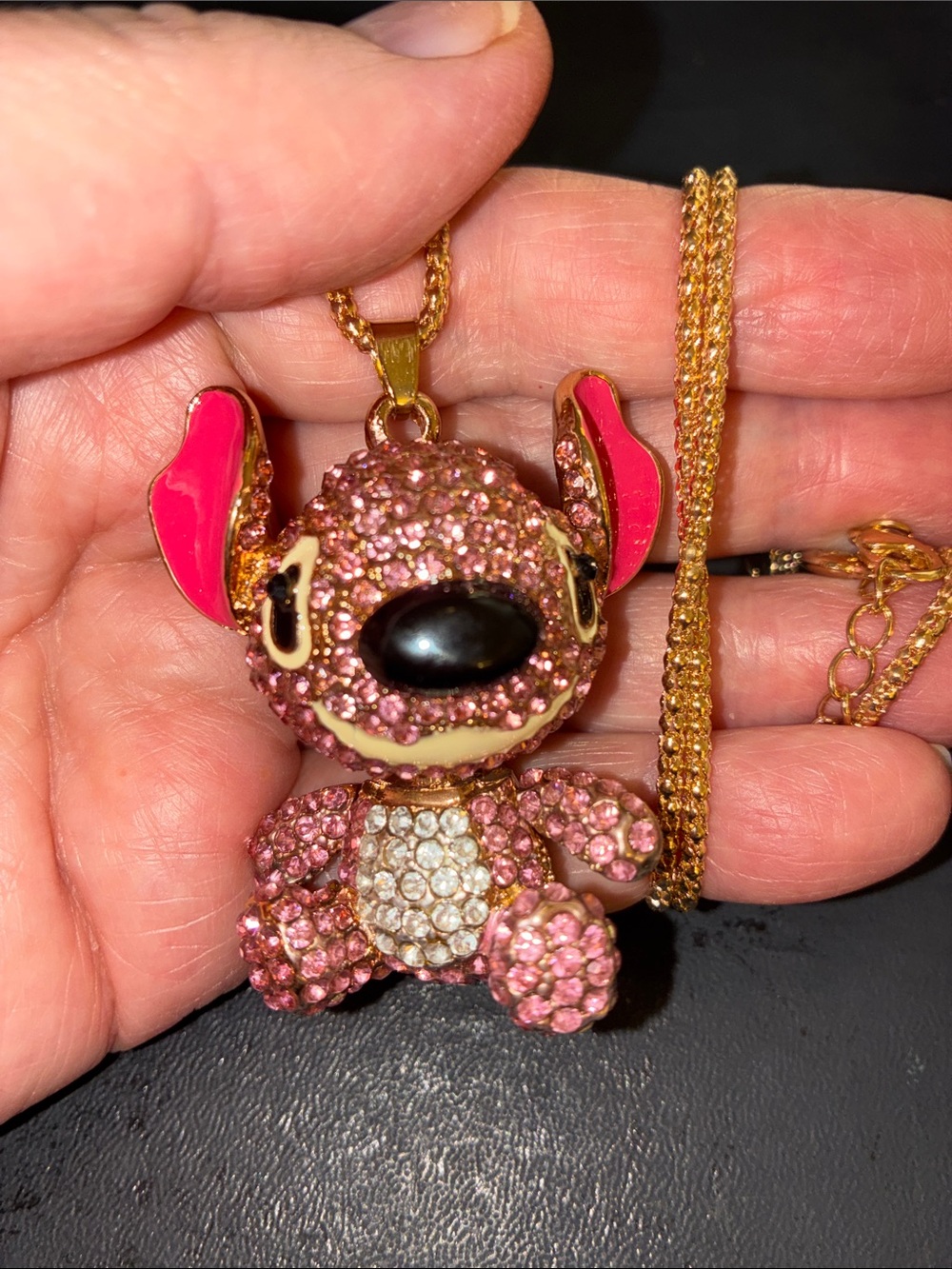 Pink Crystal Stitch Pendant Necklace. Stitches Head Turns Let and Right & Arm